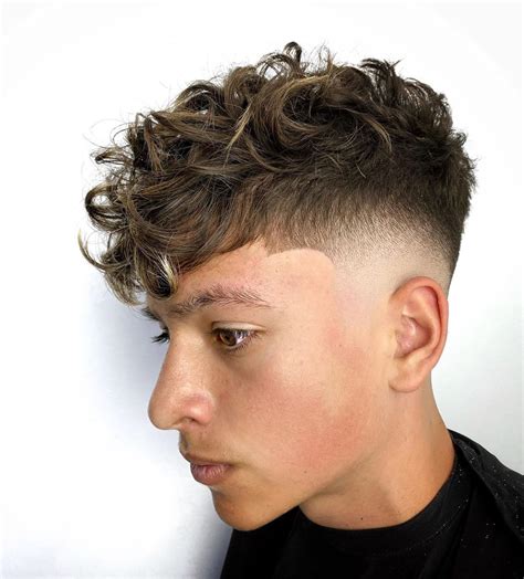 4. High Fade. The high fade is a striking look with a high-contrast bald fade that definitely requires an expert barber to hit the right mark. The skin is shaved bald on a high line around the ears up to two inches above. From this point, the cut quickly transitions into the hairstyle at the top of your head.